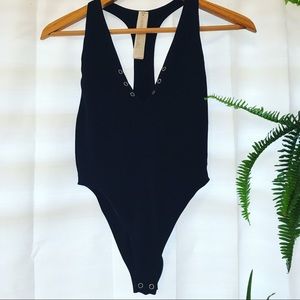 USA size Medium/Large button down Black onesie